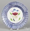 Blue spatter plate, 19th c., with tulip decoration, 9 1/4'' dia.