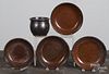 Four redware shallow bowls, together with a small crock, 3 3/4'' h., 7'' dia.