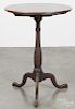 Cherry candlestand, early 19th c., with a paterae inlaid top, 29 1/4'' h., 21 1/2'' w.