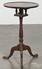 Walnut candlestand, late 19th c., with a birdcage support, 28'' h., 17 1/4'' w.
