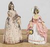 Two cast iron women doorstops, ca. 1900, 11 1/2'' h., and 10 1/2'' h.