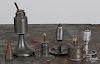 Four American pewter oil lamps, 19th c., together with a tin lamp and snuffer, tallest - 7 1/4''.