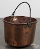 Copper kettle, 19th c., with a swing handle, 14'' h., 19'' dia.