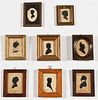 8 Antique Cutout Silhouettes Over Fabric