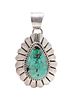 * A Sterling Silver and Turquoise Pendant, Marcella James, Navajo, 8.10 dwts.