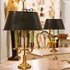 Pair of French Gilt Metal and Tole Bouillotte Lamps and a Louis XVI Style Gilt-Bronze Two-Light Candelabra