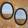 Pair of Irish Inspired Ebonized Parcel-Gilt and Cut-Glass Oval Mirrors, Modern