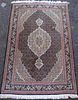 Persian type Mocha ground rug with concentric medallions 60cm x 105cm
