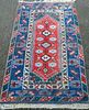 Persian type blue ground rug with stepped medallion 224cm x 120cm