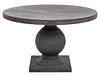 Made Goods "Cyril" concrete round dining table raised on carved pedestal in age gray reconstitute stone finish. 29" H x 48" Diameter