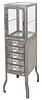 Dulton stripped metal industrial oiled finish metal pharmacy or doctor/dental cabinet, raised on tapered legs, glass door to top and five drawers to l