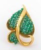 Marilyn Cooperman (Canadian, 1936-2020) emerald 18K yellow gold brooch pin; fabricated in fluted and brightly polished 18K yellow gold, featuring 65 f