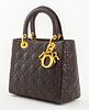 Christian Dior Lady Dior Cannage purse handbag in dark chocolate brown leather, with gold-tone metal hardware and "D-I-O-R" charm, two top handles and