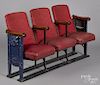 Three theater seats, ca. 1930, with ornate cast iron sides, one having illuminated apertures