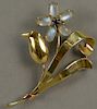 14K Tiffany brooch, floral design set with moonstones and blue sapphire. 
ht. 3in. 
14.9 grams