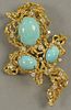 18K free form brooch set with three cabochon cut turquoise and 14 diamonds. 
total weight 40.7 grams