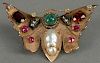 14K butterfly pin set with diamonds, rubies, emerald, and pearl. 
wd. 2 1/4in. 
14.3 grams