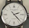 Baume & Mercier automatic round stainless steel wristwatch with box.