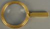 14K gold framed Art Nouveau style magnifying glass in original leather case (glass has crack).  lg. 4 3/4in.  total weight 20