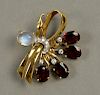 18K gold floral pin set with red stones, eight diamonds, and moonstones, marked on reverse: Yard K.  wd. 1 3/4in.  total weig