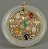 White jade round pendant, middle set with 14K gold and six colored hardstones.  dia. 1 7/8in.