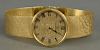 Universal 18K gold mens wristwatch with 18K gold mesh band, marked on dial: Universal Geneva.  total weight 80 grams
