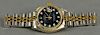 Rolex stainless and gold ladies wristwatch having black dial, set with eleven diamonds.