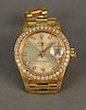 Rolex 18K gold ladies wristwatch, Oyster Perpetual Datejust superlative chronometer, the face with diamond surround and diamo