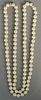 Pearl necklace mounted with two gold and diamond rondels, 8mm. 
lg. 34in.