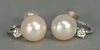 Tiffany & Co. pair of earrings set with pearl and small diamond having screw backs.
