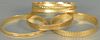 Five 18K gold bracelets. 
77.9 grams