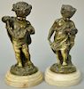 19th Century 
Pair of figural bronze 
Putti Figures Holding Flowers 
ht. 7 1/2in.