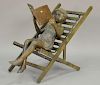 Bronze chair with bronze child reading a book, late 20th century.  ht. 29in., wd. 21 1/2in., dp. 32in.
