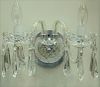 Set of three Waterford crystal double arm wall sconces with prisms.  ht. 15in., wd. 13in.