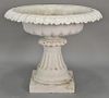 Victorian iron urn with scalloped edge on fluted pedestal set on plain square base, 19th century. ht. 28in., dia. 35in.