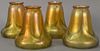 Set of four Quezal art glass shades, gold iridescent and pulled feather design.  ht. 5 1/4in.