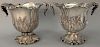 Pair of silverplate wine buckets with scrolled tops having leaf, scrolled handles, and embossed leaf and cattails on body set