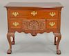 Margolis mahogany lowboy having rectangular top with notched corners over one long drawer over three short drawers, center dr
