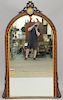 Victorian rosewood pier mirror having hand painted porcelain plaque with incised gilt carved ribbon.  81" x 42"