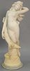 Carved marble sculpture of scantily clad female figure on crescent moon on naturalistic base.  ht. 43in.