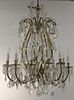 Crystal and brass chandelier having flat and faceted crystals with twelve outside lights and seven inside lights. 
ht. 36in.,
