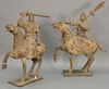 Pair of Chinese warriors on horseback, wood and gesso, 20th century .  ht. 47in., lg. 40in. & ht. 52in., lg. 40in.