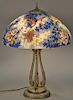 Handel blue pheasant reverse painted table lamp having colorful exotic pheasant flying above rich in color flowers and foliag