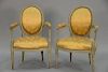 Pair of Louis XVI style fauteuil in silk upholstery and grey paint, probably 19th century.  ht. 35 1/4in., wd. 23 1/2in.