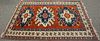 Kazak style Oriental throw rug, late 20th century. 
4'8" x 6'