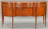 Margolis mahogany sideboard having shaped serpentine top over conforming case with three drawers over four doors plus two bot