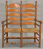Wallace Nutting ladder back two seat settee (one seat with minor imperfection). ht. 50in., wd. 43in.