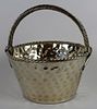 Hand hammered basket with handle