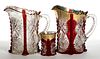 BUTTRESSED SUNBURST - RUBY-STAINED DRINKING ARTICLES, LOT OF THREE