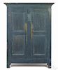 Painted pine wall cupboard, early 19th c., retaining an old scrubbed blue surface, 75 1/2'' h.